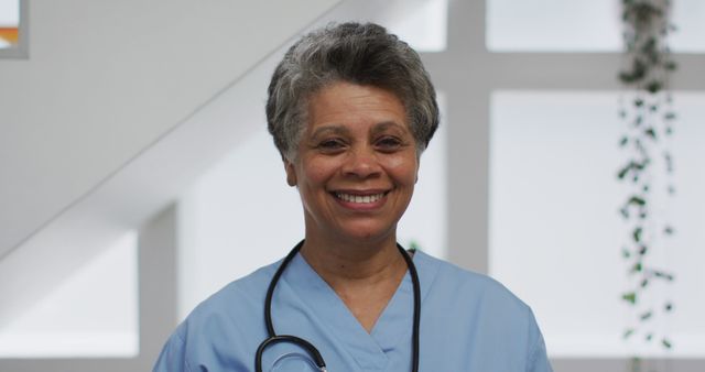 Smiling Senior Nurse in Scrubs with Stethoscope - Download Free Stock Images Pikwizard.com