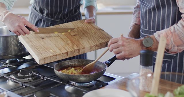 Middle Aged Couple Cooking Together in Home Kitchen - Download Free Stock Images Pikwizard.com