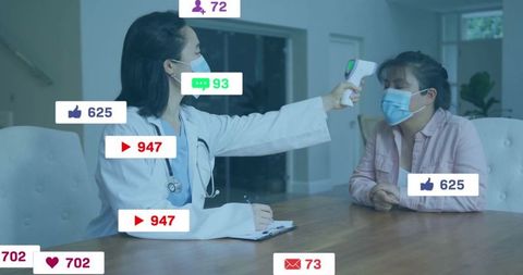 Doctor measuring temperature of patient in clinical setting with digital devices