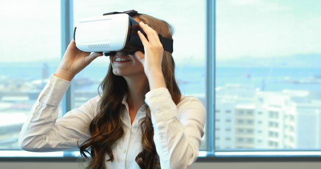 Woman Enjoying Virtual Reality Experience in Modern Office - Download Free Stock Images Pikwizard.com