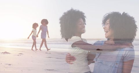 Happy Mother and Daughter Bonding on Sunny Beach Walk