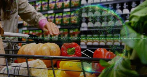 Shopper pushing cart with pumpkin and peppers in supermarket aisle with glitch overlay
