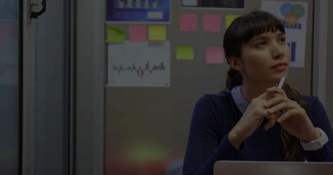 Thoughtful Businesswoman Reflecting at Workstation