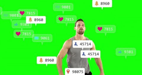 Male athlete posing in green chroma-key studio with floating social media notifications