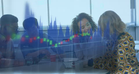 Colleagues Analyzing Data with Financial Charts Overlay