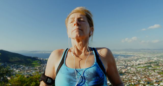 Woman Relaxing After Exercising Outdoors With Stunning City View - Download Free Stock Images Pikwizard.com