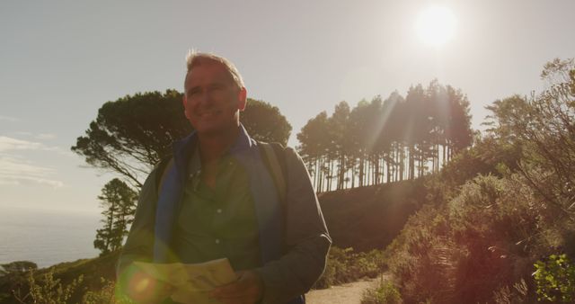 Man Hiking Trail With Map in Forest Sunlight - Download Free Stock Images Pikwizard.com