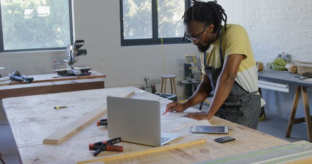 Carpenter Using Laptop in Workshop for Blueprint Design - Download Free Stock Images Pikwizard.com