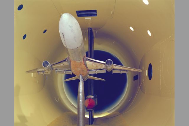 Lockheed L-1011 model undergoing aerodynamics testing in wind tunnel. Used for aerospace engineering, research presentations, technical publications and design optimization processes.
