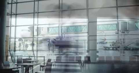 Busy airport terminal with jet at gate and blurred passengers moving through concourse