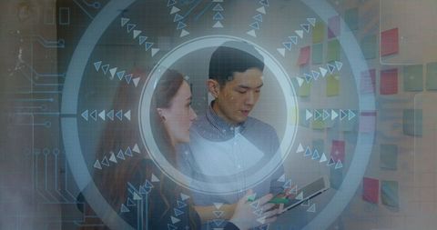 Coworkers Collaborating with Digital Interface in Modern Office