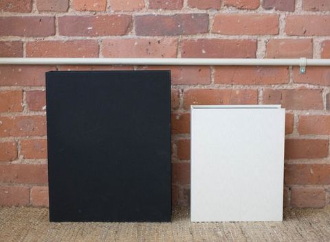 Modern brick wall backdrop as a template with black and white folders