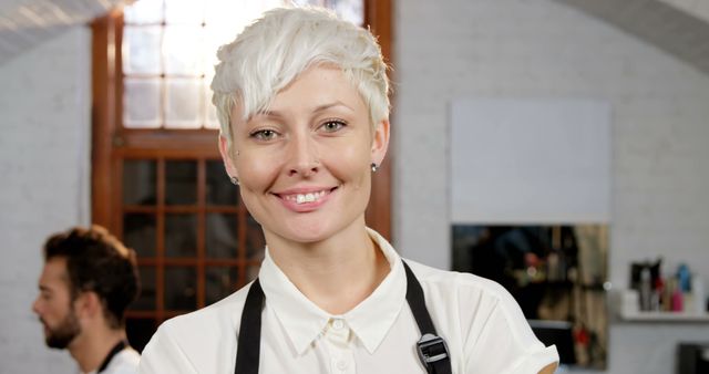 Confident Female Hairdresser Smiling in Hair Salon - Download Free Stock Images Pikwizard.com