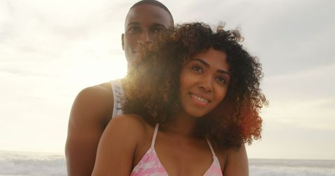 Romantic African American Couple Embracing on the Beach at Sunset - Download Free Stock Images Pikwizard.com