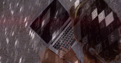 Child typing on laptop with code overlay and light rug background