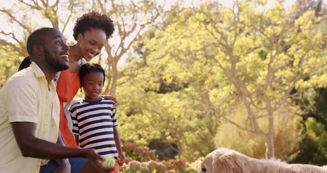 Happy African American Family Playing with Golden Retriever in Sunny Park - Download Free Stock Images Pikwizard.com