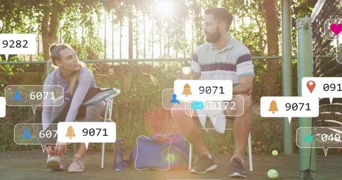 Tennis players tying shoes on court with social media notification overlays and lens flare