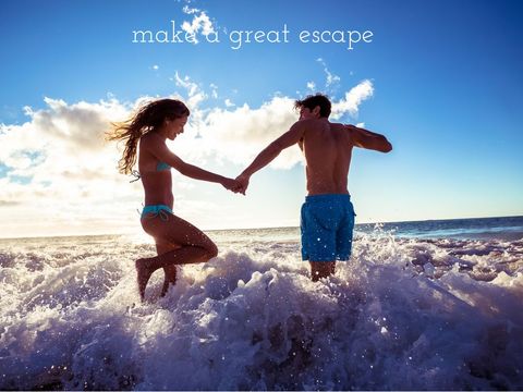 Joyful Couple Running Through Surf Embracing Adventure