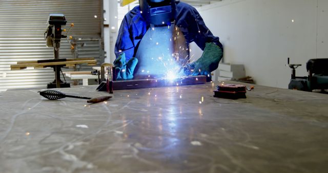 Welder in Protective Gear Working with Metal - Download Free Stock Images Pikwizard.com