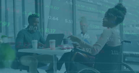 Diverse Colleagues Analyzing Financial Data in Office Environment