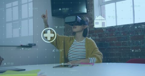 Businesswoman Innovating in VR with Financial Data Overlay