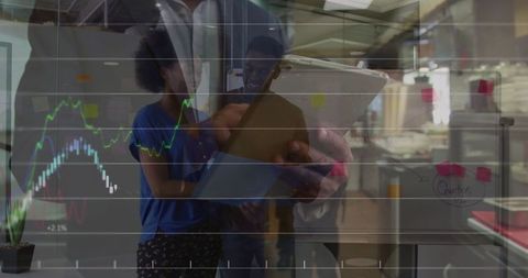 Team analyzing data on digital tablets with growth chart overlay