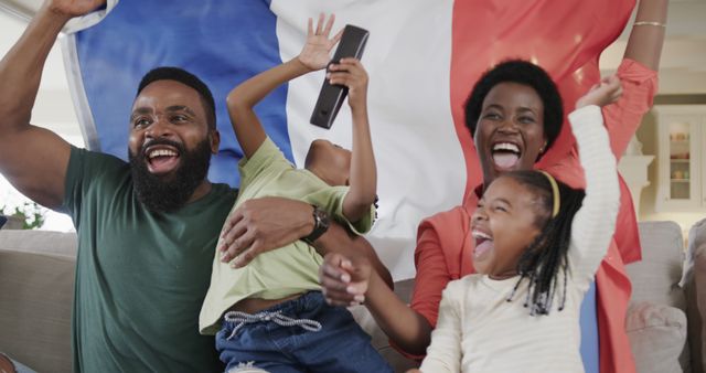 Portrait of happy african american family raising hands and supporting with flag of france at home - Download Free Stock Photos Pikwizard.com