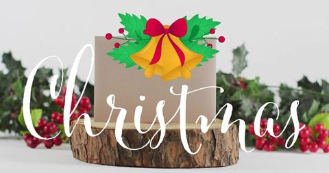 Rustic kraft gift box on wood slice with holly berries and christmas bells overlay, festive