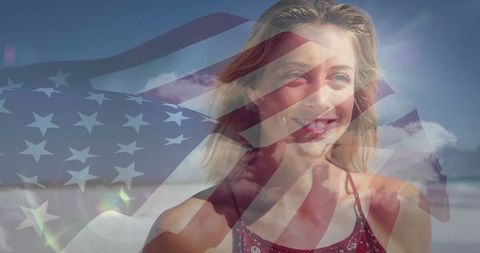 Smiling woman on sunny beach with american flag overlay expressing patriotic summer freedom