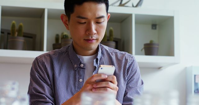 Serious Young Man Texting on Smartphone in Coffee Shop - Download Free Stock Images Pikwizard.com