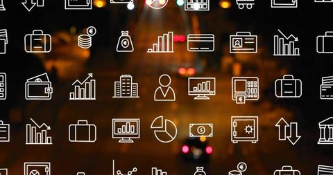 Financial Icons Overlaying City Street at Night with Blurred Taillights, Charts and Data