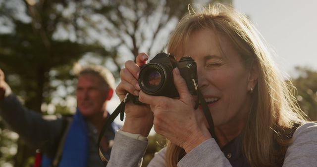 Senior Woman Enjoying Outdoor Photography with Digital Camera - Download Free Stock Images Pikwizard.com