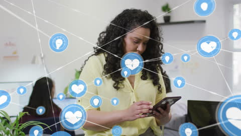Woman Networking with Digital Icons in Modern Office