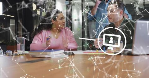 Collaborative Professionals Strategizing with Digital Interface Overlay