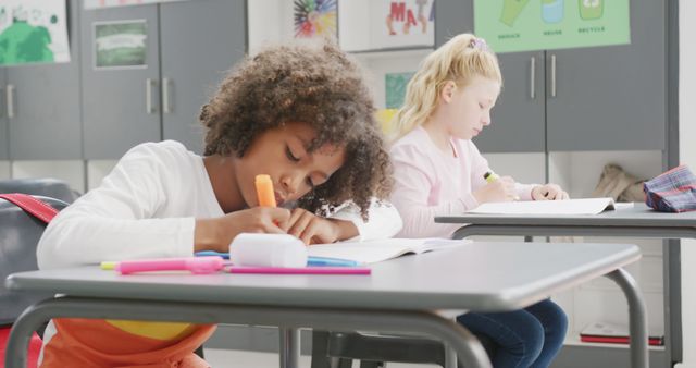 Diverse children concentrating during classroom activity - Download Free Stock Images Pikwizard.com