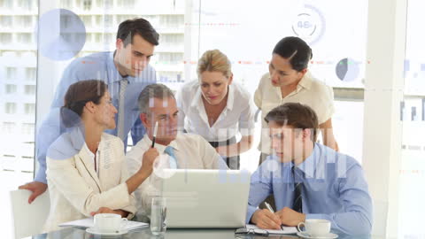 Business Team Analyzing Financial Data on Laptop in Office