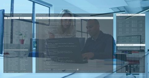 Tech pair reviewing code with cybersecurity terminal overlay in modern workspace