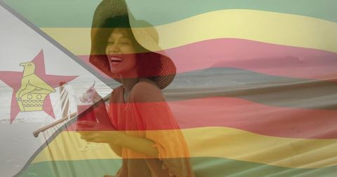 Woman sipping drink by beach with zimbabwe flag overlay