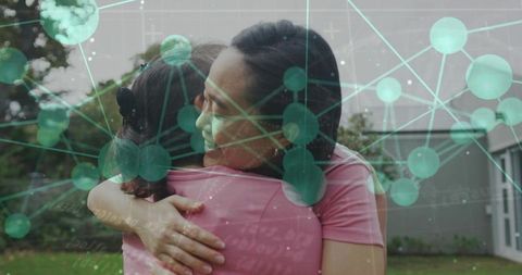 Hugging adults embracing in backyard with green network overlay showing connection
