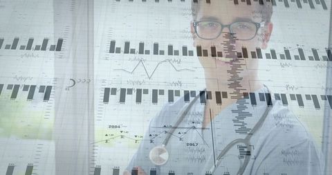 Clinician Holding Stethoscope Studying Medical Data Overlays While Wearing Eyeglasses