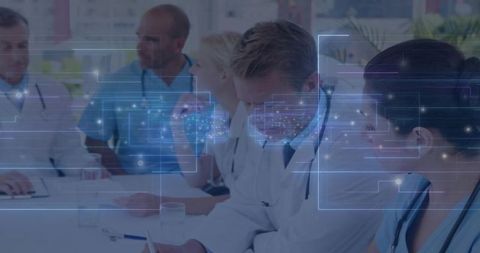 Doctors Analyzing Holographic Data in Conference Room