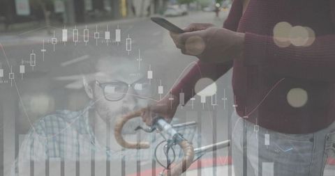 Urban cyclist checking smartphone with financial data overlay and trading candlestick graphics