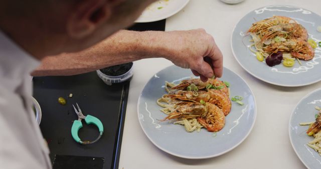 Chef Plating Gourmet Shrimp Pasta Dish in Professional Kitchen - Download Free Stock Images Pikwizard.com