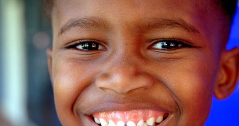 Close-Up of Smiling Child Expressing Joy and Confidence