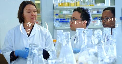 Diverse Scientists Collaborating with Data in Modern Laboratory - Download Free Stock Images Pikwizard.com
