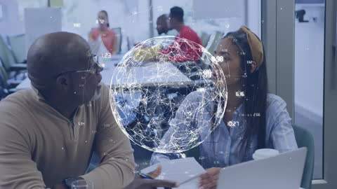 Diverse Professionals Discussing Business Technology in Modern Office