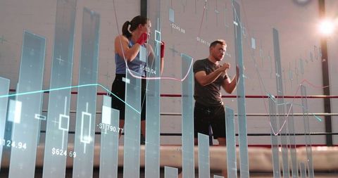 Boxing sparring with fitness analytics overlay and holographic charts for performance tracking