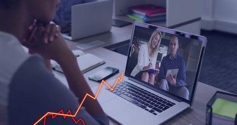 Remote team watching virtual presentation on laptop with rising chart overlay for collaboration