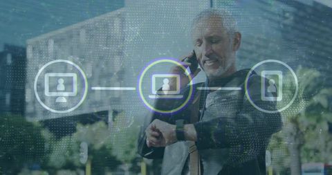 Senior professional calling and checking smartwatch with digital device connectivity overlay