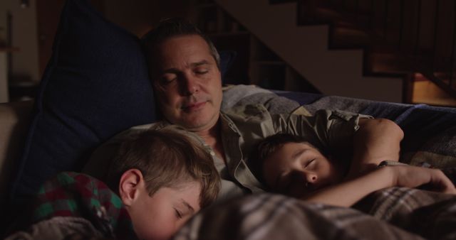 Father Napping with Two Sons on Couch Under Blankets - Download Free Stock Images Pikwizard.com